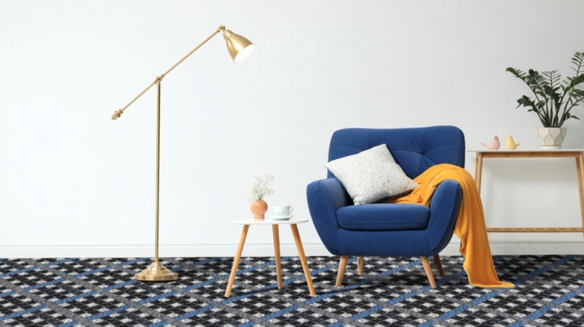 Stylish living room interior with comfortable furniture near white wall